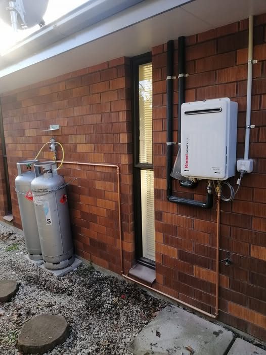 Another conversion on a brick exterior &mdash; Rinnai Infinity, with the gas run and flue set out clear of the window