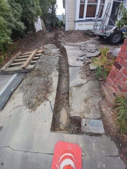 Water main replacement under way &mdash; the new supply line trenched in from the toby